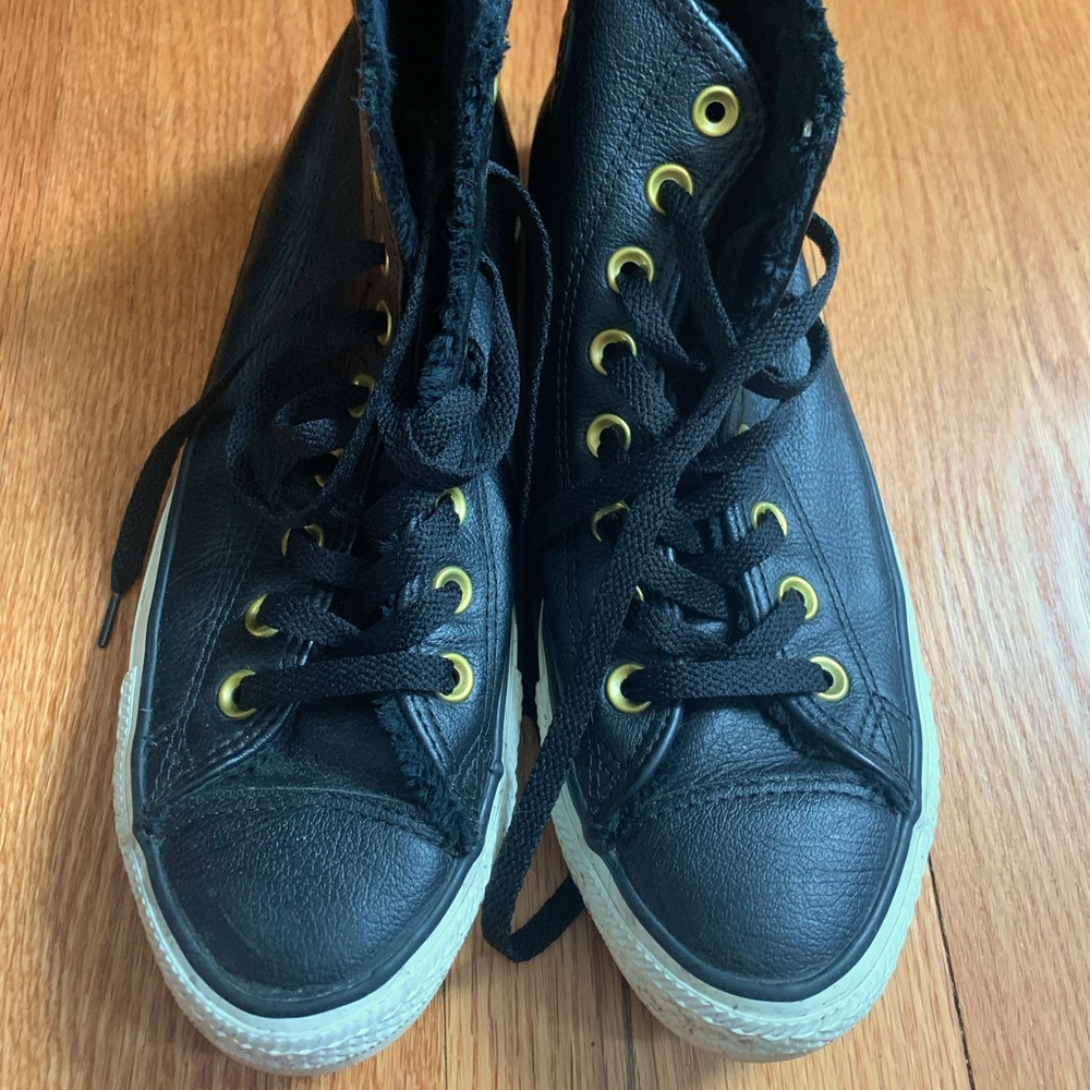 Black leather Converse with fur interior.